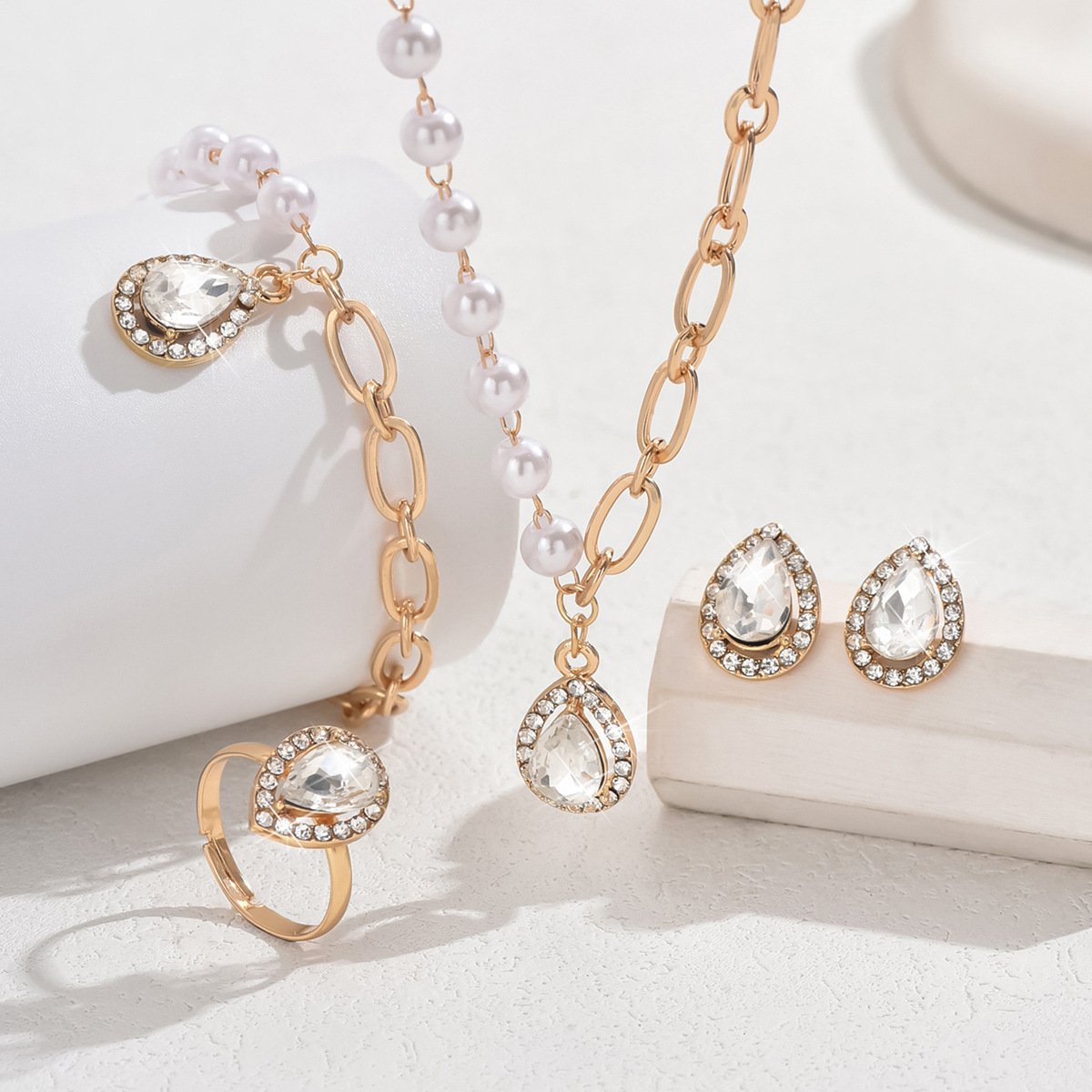 Fashionable Diamond-Encrusted Water Drop Earrings, Necklace, Ring, And Bracelet Set, Sweet And Simple Asymmetrical Pearl Clavicle Chain Wholesale